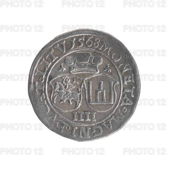 Lithuanian four-piece, Sigismund II Augustus King of Poland; 1544–1572 author, coats of arms, Jagiellons dynasty, Polish coins, Pogon coat of arms; Lithuania, male busts, royal bust iconography, Columns of Gediminas coat of arms, Sigismund II Augustus King of Poland; 1520–1572 - iconography. Obv.: Crowned male bust in armour turned right, inscription around: .SIGIS.AVG.DGREX.PO.MAG.DVXL. Rev.: Under the prince's mitre, two coats of arms with the Pogon and Kolumny coats of arms, below the value number IIII, in the rim the inscription: MONETA.MAGNI.DVCAT.LITV 1568. 1568. Vilnius, Grand Duchy of Lithuania. Coin., A round metallic coin with a worn silver-gray surface, showing a raised circular border and an inner circle divided into two shield-like panels beneath a stylized crown; one panel contains an embossed figure of a mounted rider and the other contains vertical architectural-like shapes, with a few small decorative motifs around them and a group of raised marks near the bottom edge.