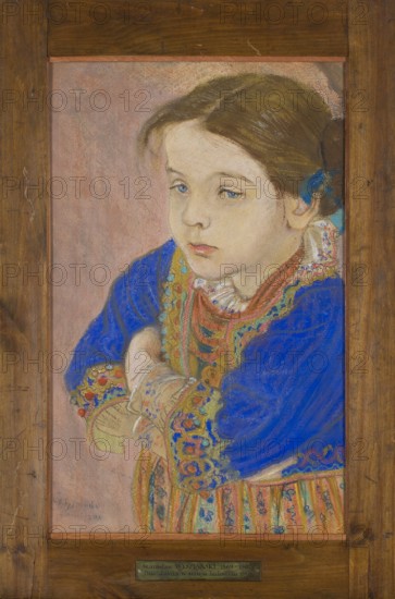 Girl in folk costume, Wyspianski, Stanislaw 1869–1907 painter, portraits of children, folk costumes, 1901, pastel, height 48.5 cm, width 30 cm, A framed portrait of a young girl shown from the waist up, wearing a richly patterned outfit with a bright blue outer garment and multicolored decorative trim; she has light skin, brown hair pulled back with a blue ribbon, and a calm, slightly downcast facial expression with visible pale blue eyes and pink lips. Her folded arms rest in front of her, and the clothing includes patterned sleeves and a striped, colorful lower garment with warm tones. The background is a soft muted pink, and the frame around the portrait is a medium brown wood. Colors visible include blue, brown, pink, beige, red, green, yellow, and orange.
