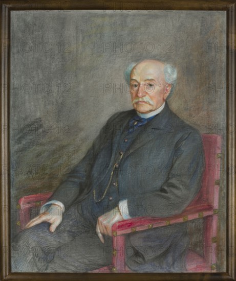 Portrait of Mathias Bersohn, painted by Mathias Bersohn 1824–1908. Pastel on paper, 1909. Depicts a male portrait of Mordasewicz, Kazimierz 1859–1923. Height 82 cm, width 68 cm. Polish pastel, iconography relating to Jews; Masters of pastel., A painted portrait of an older man seated in a chair, wearing a dark suit with a vest and a white shirt collar, with a mustache and thinning white hair, pale skin, and a neutral facial expression; he rests one hand on his knee and the other on the armrest of a reddish-pink upholstered chair with small decorative accents; the background is a textured grey with subtle shifts in tone; visible colors include grey, dark blue, white, pale skin tones, reddish-pink, brown, and hints of gold.