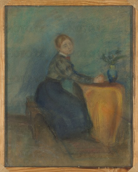 Portrait of a Girl Sitting at a Table, Olga Boznanska 1865–1940, painter; genre scene, Young Poland; Poland; women; Polish painting; ca. 1892; pastel drawing; 45 x 36 cm., A seated woman wearing a dark skirt and a lighter top sits at a draped table covered with a warm yellow-orange cloth, her arms resting on the table near a blue vase that holds a small arrangement of foliage; the background is muted with hazy shades of blue and green, the floor and bench beneath her appear in subdued brown and gray tones, and the painting is shown within a light wooden frame.