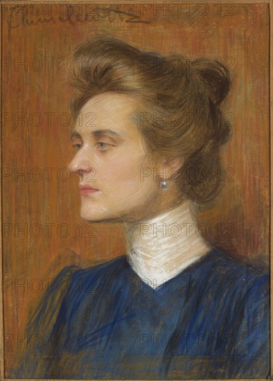 Portrait of a Woman, Julian Chmielewski 1868–1934, painter; portrait of a woman, 1899; pastel; inscribed/label details present; dimensions in frame: height 49 cm, width 34.7 cm., A side-profile portrait of a woman with light skin and brown hair swept up into a voluminous updo, wearing a small round earring and a high white collar; she is dressed in a dark blue garment and set against a warm brown and orange textured background, with subtle highlights of beige, pink, and muted green visible in the hair and skin tones.
