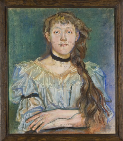 Portrait of Maria Waskowska, Wyspianski, Stanislaw 1869–1907 painter, Waskowska, Maria 1875–1959 - iconography, female portraits; 1894; pastel; 65.8 × 57 cm., A framed painted portrait of a young person with long wavy brown hair draped over one shoulder, wearing a light ruffled blouse and a dark choker. The background is a textured greenish-blue with subtle variations. The subject's skin tones include pale pinks and warm beige, with visible facial features and a neutral expression. The blouse shows soft folds and highlights in white and pale blue, with darker blue and gray shadows. The hair contains shades of brown with warm golden highlights. The hands rest in front, showing pale skin tones and subtle shading. The frame is dark wood with a visible grain.