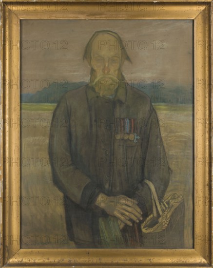 Invalid - veteran, Rembowski, Jan 1879-1923 painter, male portraits, military veterans, orders, 1917, pastel, height 112 cm, width 86 cm, A framed portrait of an older man standing against a muted landscape; the frame is gold with a slightly worn patina. The man has a long face with a receding hairline and a mustache and beard rendered in yellowish and pale green tones. He wears a dark, muted coat in shades of brown and gray, and there are a few small medal-like shapes on his chest with accents of red and blue. His hands are visible in the lower part of the image, rendered in pale flesh tones, one resting over the other and holding a woven basket with beige and tan strands. The background shows a flat field and a distant tree line in subdued greens and blues beneath a cloudy sky in gray and taupe. Overall the color palette is earthy and muted with browns, grays, greens, beiges, and touches of yellow and blue.
