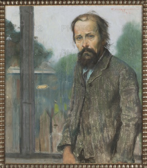 Portrait of a Man, Wygrzywalski, Feliks Michal 1875–1944 author, male portrait, 1913, pastel, height 89 cm, width 78 cm, A painted portrait of a bearded man standing indoors near a window, wearing a worn coat in muted browns and greens with a pale blue shirt visible at the collar; his hair is dark with lighter patches and his facial expression appears somber, with a full dark brown beard and mustache and pale skin tones. The background seen through the window shows a mix of greens and bluish grays suggesting foliage and structures, with a vertical dark gray window frame and lighter gray wall. The painting is surrounded by a textured frame in brown and gold tones. Several subtle highlights and brushstrokes in white and pale colors accentuate the coat and face.