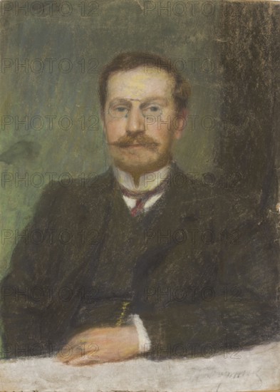Portrait of Anatol Waskowski, a Warsaw lawyer, painted by Wlodzimierz Waskowski, after 1917, pastel drawing, height 60.5 cm, width 43 cm; male portrait; inscription/subject: Anatol Waskowski; classification: painter/, A portrait of a seated man shown from the waist up wearing a dark suit jacket and vest with a white shirt collar and a dark tie with a small red accent; he has a mustache and short brown hair and is wearing small round glasses, with a light complexion and a calm facial expression; his hands rest on a light-colored surface in front of him, one hand partially visible with pale skin tones; the background is a textured mix of green and dark brown tones with some lighter green areas and worn, slightly mottled patches; overall colors visible include dark brown, black, green, pale flesh tones, white, and touches of red and yellow.