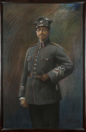 Portrait of General Józef Dowbór-Musnicki; artist: Leokadia Ostrowska 1875 or 1879–1952; subject: Józef Dowbor-Musnicki 1867–1937, full-length military portrait; date: 1919–1920; medium: pastel; dimensions: 148.5 × 96 cm; genre: male portrait., A painted portrait of a man standing in a dark wooden frame wearing a military uniform with a peaked cap; the uniform is mainly gray with red trim and silver buttons, a brown leather belt, and brown gloves, and the cap has silver insignia. The man has light brown hair and a mustache and a neutral facial expression, with one hand resting on his hip and the other hanging by his side. The background is a blend of muted colors including brown, green, blue, and hints of purple, rendered with visible brushstrokes and soft gradients. The frame is dark brown wood surrounding the portrait.
