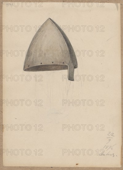 Helmet. Pen and ink drawing glued with the upper edge to brown cardboard; 1876. Drawing: 17.8 × 12.8 cm; cardboard: 35.6 × 25.7 cm. Depicts a militaria/army helmet in knights' armor style. Creator: Lesser, Aleksander 1814–1884; associated names: Lesser, Emilian 1848–1912; Lesser, Wiktor Stanislaw Zygmunt baron; 1853–1935. Ambras Austria, A light beige paper sheet with a hand-drawn, pointed helmet sketched near the top center; the helmet is rendered in shades of gray and muted brown with darker gray shading on one side and along its rim, showing a short strap-like extension hanging down on one side and a few small dark dots along the lower edge; faint pencil outlines and smudges are visible around and below the helmet, and the paper has a worn, slightly darker beige border with small blemishes and spots.
