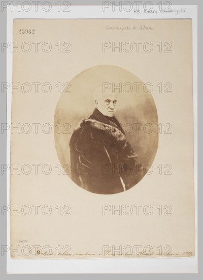 Portrait of Prince Adam Jerzy Czartoryski 1770–1861, Maujean & Cie Paris; photographic studio, oval-shaped photographic print glued to cardboard, ca. 1855, photography from nature; image oval 17.0 × 13.7 cm, cardboard 31.1 × 24.1 cm., An oval sepia-toned photograph centered on a pale beige rectangular mount shows an older person with a solemn expression, turned slightly in three-quarter view, wearing a dark coat with a fur collar; the background within the oval is mottled and softly shaded in brownish tones, and the mount around the oval is a light cream with a narrow pale gray border and a few small, faint marks.
