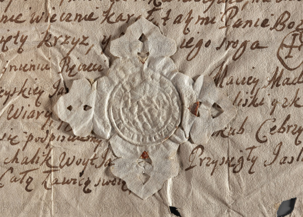 Round seal impression of the town of Jasliska, Ruthenian Voivodeship. On a baroque shield, two pickaxes crossed diagonally, leaves in three fields. Illegible inscription on the rim. 1742, Poland.