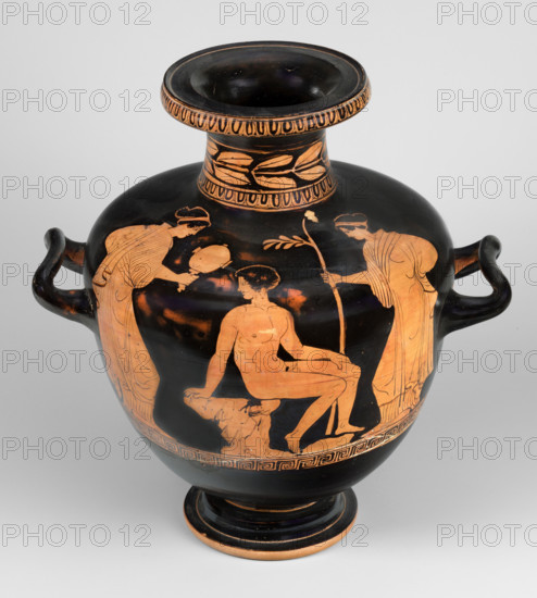 Red-figure hydria by the Amycus Painter, c. 420–400 BC (dating before a 2019 revision: c. 420–410 BC). Lucanian red-figure hydria on a high profiled foot; weight 2.056 kg. The belly widens evenly to broad, slightly sloping shoulders and a neck terminating in a wide profiled rim. The neck is decorated with an ovoid at the base and a band of leaves; the ovoid also surrounds the rim edge. The figurative scene on the belly and shoulders, above a meander band, shows a naked youth seated on a rock. A man in profile turns back, leaning against a rock with his right hand and resting his left hand on his left knee; the youth is slender with clearly defined muscles. The ephebe is flanked by two female figures in lavish robes: the woman to his left holds a mirror whose reflection the youth gazes into, while the woman on the opposite side holds a long branch topped with leaves in her right hand. Both females hold their left hands near the hip and lean slightly toward the ephebe.