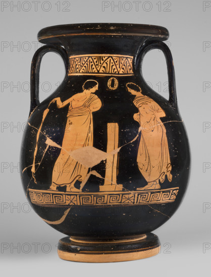 Red-figure pelike depicting a woman putting on a pearl necklace; Southern Italic (Apulian) pottery, reddish-yellow clay, c. 380 BC. Pelike with a bulging belly, thick disc-shaped foot, and ribbon-like handles; edge and underside of foot left the color of clay. Around the neck: band of straight and inverted palmettes in a zigzag. Below the belly scene: a meander interrupted by horizontally filled rectangles. Obverse: a woman seated on a klismos holding a necklace, wearing a finely pleated chiton, a cloak wrapped around her hips and knees, and a diadem on her head; to her right a girl stands leaning against a small column; behind her a naked youth with a cloak over his left arm holds a small disc or sphere in his right hand. Reverse: two youths in cloaks flank a stele with a base seen in perspective; a wreath above the stele. Vessel type: pelike; height 29.3 cm, width 21.5 cm.