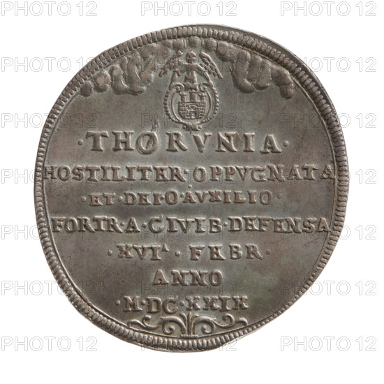 Torun siege medal thaler, Sigismund III Vasa (King of Poland; 1587–1632), medal thaler, Torun (Kuyavian-Pomeranian Voivodeship). Obv.: Coat of arms of Torun, below an inscription in seven lines: .THORVNIA. HOSTILITER.OPPVGNATA .ET.DEI.O AVXILIO. FORTR.A.CIVIB.DEFENSA. .XVIA . FEBR. Reverse: View of burning Torun with the Vistula River in the foreground. Below the river line, a small, partially erased date is visible: 1, 0. Two angels with a wreath hover over the city. In the rim, an inscription divided at the top by an ornament: FIDES . ET . CONSTANTIA . PER . IGNEM . PROBATA .ANNO. MDC.XXIX. Below an ornament. 1629. Poland, Torun, coin, dia. 47.6 mm