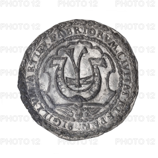 Seal of the Blacksmiths' Guild. Bronze seal (rim-inscribed) depicting on the decorated inner rim a shield with a horseshoe and a hammer—attributes of blacksmiths' work. Rim inscription: 'SIGILLUM ARTIFU . FABRIORUM CIVITAT KLEPAR .' Dated 1366. From Kleparz (near Kraków), Poland.