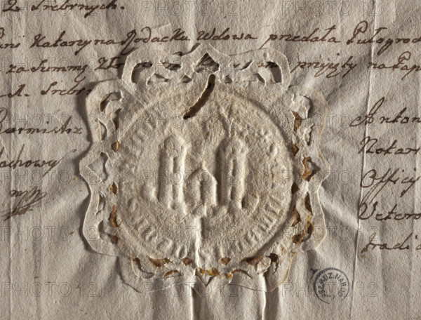 Round seal impression of the city of Czestochowa. Fortress wall with an open gate and battlements. Above the wall are two side towers with two windows. Above the roof of the right tower is a lion; above the roof of the left, a raven. Inscription on the rim: + S. CIVITATIS . CZANSTHICO. Dated 1564. Poland. Seal.
