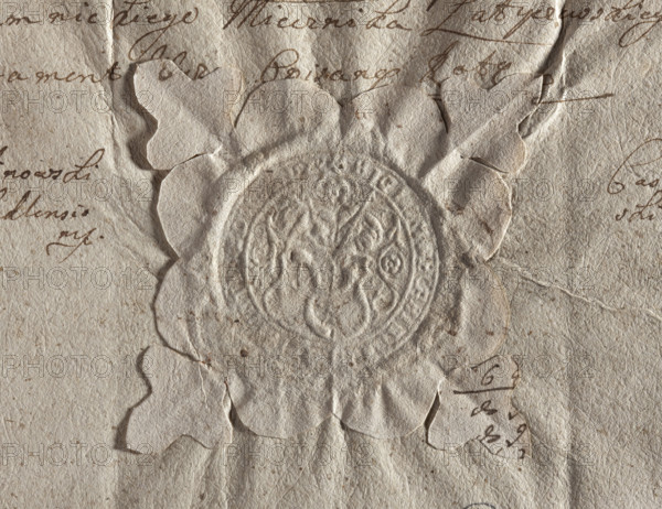Round seal impression of the town of Dukla, Kraków Voivodeship. Figure of Saint John the Baptist holding a shield with the Traby coat of arms. Illegible inscription on the rim. 1748, Poland. Type: town seal; official/document seal; round seal impression; seals with coats of arms; seals with the image of a saint; Soviet seals not applicable. Maker/date: 1748; maker unknown.