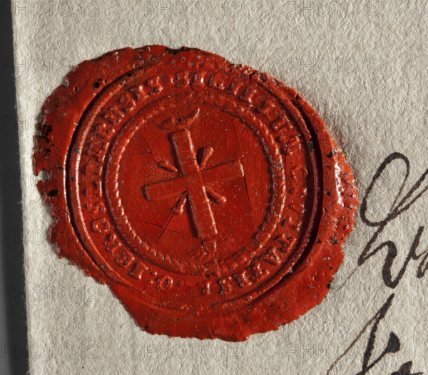 Wax impression of the seal of Góra Kalwaria. An equal-armed cross with rays emanating from the arms. Above the upper arm — a moon; under the lower arm — the Eye of Providence. In the rim an inscription: 'SIGILLUM CIVITATIS, IEROSLIMENSIS.' Dated 1802. Poland. Seal. Dimensions: 26.5 mm and 28.5 mm.