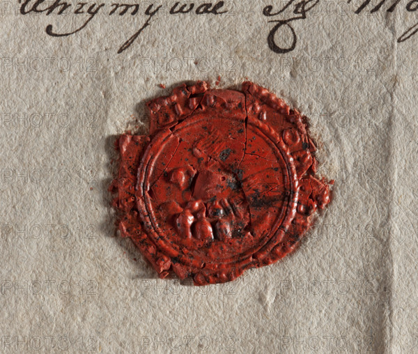 Round wax impression of the seal of Grabów. Pelican turned to the right on the nest, feeding chicks. Illegible inscription on the rim. 18th century, Poland. Seal; town seal of Grabów (Grabów nad Prosna), official town coat of arms.