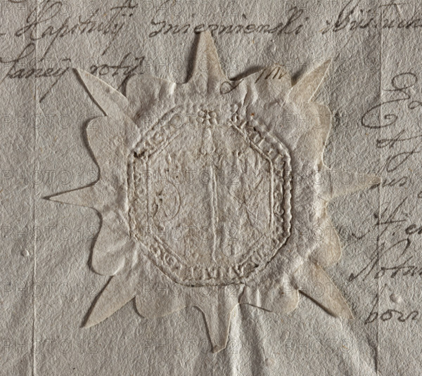 Rectangular seal impression with truncated corners of the town of Grzybowo. Depicts a downward-pointing sword between a palm branch and a circle. On the sides are the letters 'SC // PG'. Illegible inscription on the rim. 1707. Seal, Poland. Dimensions: 35 × 40 mm.