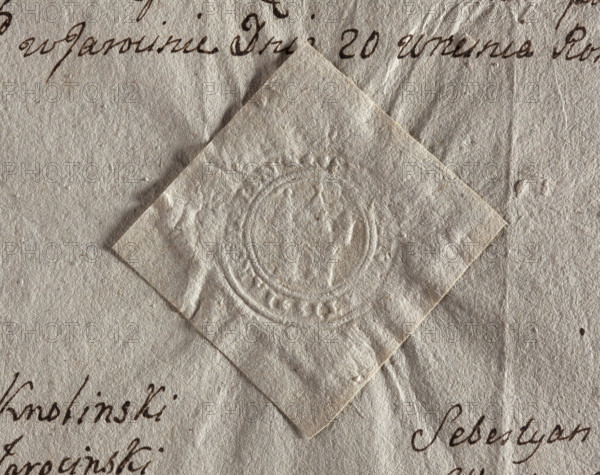 Round seal impression of the town of Jarocin, Sieradz Voivodeship. Tower with an open gate, topped with three turrets with pointed roofs. Illegible inscription on the rim. 1779, Poland, city seal of the town of Jarocin; seals with architectural structures; seals attached to documents; official seal; round seal impression.