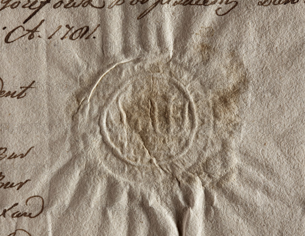 Round seal impression of the town of Józefów, Lublin Voivodeship, Urzedów County. On the wall (Prawdzic coat of arms) half a lion holding a shield with the Pilawa coat of arms. Illegible inscription on the rim. 1773, Poland.