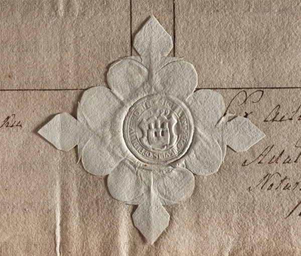 Round seal impression of the town of Jutroszyn, Kalisz Voivodeship. On the shield a wall with two windows and three towers topped with battlements; the middle tower is higher. In the rim an inscription: SIGILLUM PROCONSULIS OPIDI IVTROSIN. Above the shield the date 1699. Labels: town seal of the town of Jutroszyn; town seals; official seals; seals with an architectural structure; seals attached to documents; Round seal; Poland; Zurakowski, Witold (?-1927).