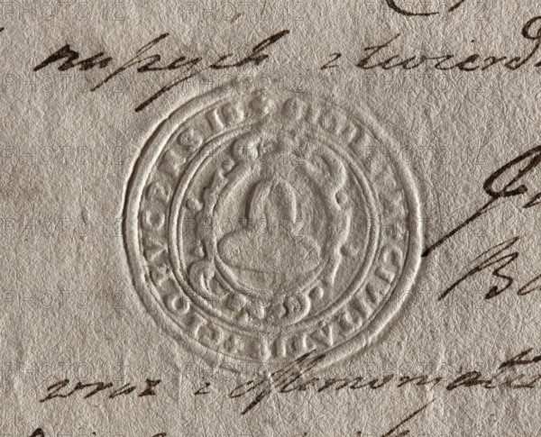 Round seal impression of the town of Klobuck, Kraków Voivodeship. On a decorative Baroque shield, a helmet called a klobuk with a branch at the top. Inscription around the rim: + SIGILLUM + CIVITATIS + CLOBVCENSIS +, 1792, Poland, seal