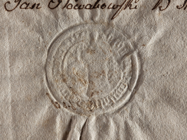 Round seal impression of the city of Koniecpol, Sieradz Voivodeship. In the field of the seal dotted with stars, there is a semi-horseshoe with the shoulder up with a studded knight's cross (the Pobóg coat of arms is damaged). Illegible drawing inside and rim inscription. 1779, Poland, seal