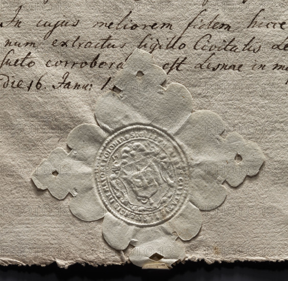Oval seal impression of the town of Leszno in Greater Poland. In the middle of the baroque shield, a smaller one showing a wall, and above it a half eagle—the Sulima coat of arms. At the top, the date 1741. Inscription on the rim: SIGILLUM MINUS CIVITATIS LESNENSIS IN MINORI POLONIA. 1741. Poland. Seal. Sizes: 33 mm and 36 mm.