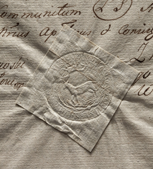 Round seal impression of the town of Losice. Under the crown in a rim of palm branches, a female moose turned to the right. Illegible inscription on the rim. 1729, Poland.