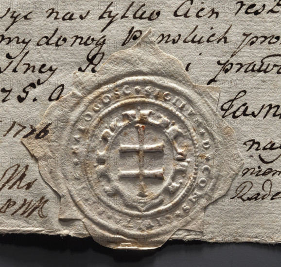 Round seal impression of the town of Malogoszcz. In a decorative cartouche, a double cross — the dynastic sign of the Jagiellonian dynasty. In the rim, the inscription: *SIGILUM D CONS CIVITA MALOGOSC*; dated 1775, Poland.