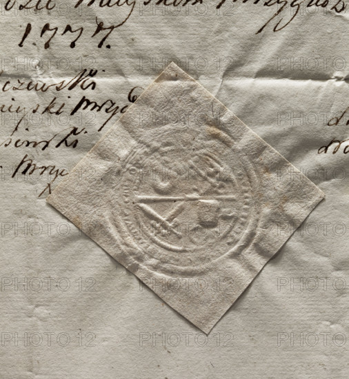 Round seal impression of the town of Mrzyglód. Central quadripartite field with an illegible drawing in each quadrant; illegible inscription on the rim. Seal with coat of arms, official town seal, 1777, Poland.