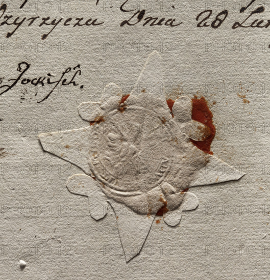 Round seal impression of the town of Miedzyrzecz. In the central part of the seal, an illegible drawing. The note inscription is illegible. 1777, Poland. City seal of Miedzyrzecz; seals with the town's coat of arms; seals with an eagle; official document seal.