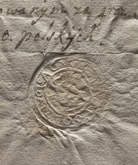 Round seal impression of the town of Odrzywól, Sandomierz Voivodeship. In the central part, in a section, an illegible drawing. In the rim, an illegible inscription. 1778. Poland. City seal of Odrzywól; official document seal with coat of arms.