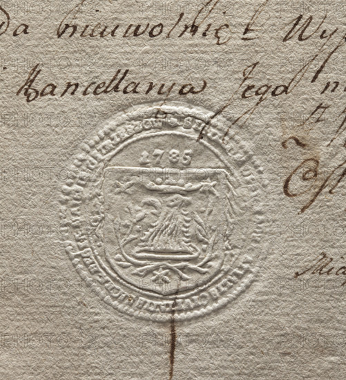 Round seal impression of the court of lay judges and mayors of the town of Ostrzeszów. On the shield is a crowned eagle's head turned to the right. Around the head are two laurel branches and three stars. Above the shield, the date 1785. Around the rim, the inscription: + SIGILLUM, ATIALIS CIVITATIS SACRAE REGIAE MAIESTATIS OSTRZESZOW +. Seal; 1785; Poland.