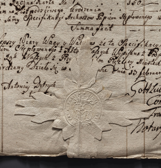 Round seal impression of the town of Rostarzewo. In a baroque crowned cartouche there is the monogram RMR. Above the letter M there is a star; on the sides of the crown the date 17 54. In the rim an inscription reads: * SIGILUM, ITATIS RESTAURCENSIS. Dated 1754; Poland.