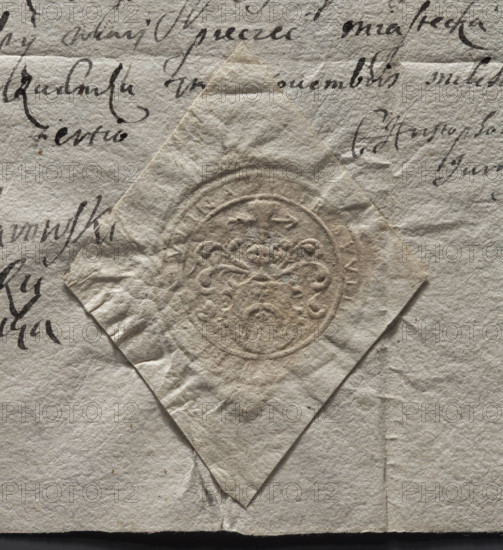 Round imprint of the Rudnik town seal. Illegible coat of arms on the shield. Above the crowned helmet, a jewel — three ostrich feathers pierced with an arrow to the left. Under the crown, a labry. Illegible inscription on the rim. 1673, Rudnik, Poland.