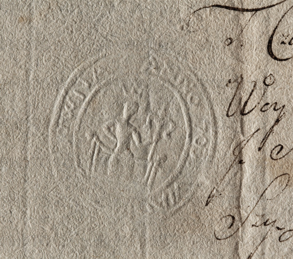 Oval dry impression of the city seal of Solca (Solec, Lesser Poland Voivodeship), impressed on a document from 1703. In the center, on the inner rim, a ruler sits on a throne wearing a crown and holding a lily-shaped scepter in his left hand. Illegible inscription on the rim. Seal (1703), Poland. Dimensions: 33 mm × 37 mm.