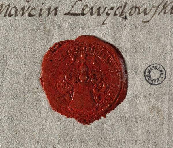Round seal impression of the town of Wagrowiec, Pila Voivodeship. Coat of arms with an illegible drawing; above the helmet a jewel: a female figure holding two horns. Under the helmet are rich lambrequins. Partially illegible rim inscription: * SIGILLUM . PROCON //, GROWIEC. 18th century, Poland, wax seal on document.