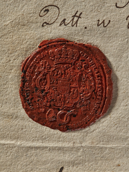 Oval wax impression of the seal of the General Post Office. Crowned shield, richly decorated with the Eagle and the Pogon, in the heart field a shield with the Ciolek coat of arms under a crown. Below, a signal trumpet. Around the rim, the inscription: GENERALIS POSTARUM REGNI, LIT PRAEFECTURA. Seal attached to a document concerning reports on the condition of roads and bridges along the letter delivery route. 1766, Poland., A close-up of an aged textured paper showing a circular red wax seal pressed onto it; the seal has an intricate raised design with ornamental flourishes and a central emblem, and there are a few small dark blemishes and fine cracks across its surface; the paper is a beige-cream color with visible fibers and slight creases, and there is a hint of dark brown ink strokes near the top edge.