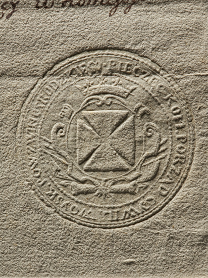 Round seal impression of the Civil-Military Order Commission of Zwinogrodzkie County, 1791. Round seal with shield bearing the coat of arms of the Braclaw Voivodeship (a knight's cross), a panoply behind the shield; inscription on the rim: 'SEAL OF THE CIVIL-MILITARY ORDER COMMITTEE OF ZWINOGRODZKIE COUNTY'. Seal used on documents; Poland., A textured, beige surface with an embossed circular seal in the center; the seal shows a central shield with a diagonal cross, decorative flourishes and scroll-like elements around it, and a surrounding circular border with raised ornamental details. The surface and embossing are in shades of beige, tan, and light brown with visible crinkled and fibrous texture.