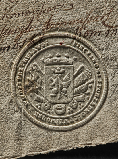 Round seal impression of the Civil-Military Order Commission of the Brzesko-Kujawskie Voivodeship. On the crowned shield the coat of arms of Kujawy; behind the shield a panoply. Inscription on the rim: PIECZ : KOMI : PORZADKO : CYWI : WOYSK : WWDZ : BRZ : KUIAWS :. 1792, Poland., A close-up of an embossed circular seal pressed into textured beige paper, showing a central shield topped by a crown and flanked by ornate decorative elements, with a few small raised circular motifs and a ringed border; the paper surface is rough and fibrous with visible creases and a torn lower edge, and there is dark brown handwriting partially visible above the seal plus a tiny red speck near the upper rim; colors include beige, cream, dark brown, and a small spot of red.