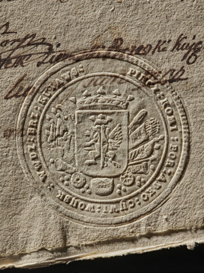 Round seal impression of the Civil-Military Order Commission of the Brzesko-Kujawskie Voivodeship. On the crowned shield the coat of arms of Kujawy; behind the shield rich panoplies are visible. Inscription on the rim: PIECZ : KOMI : PORZADKO : CYWI : WOYSK : WWDZ : BRZ : KUIAWS :. 1790, Poland. Seal; seals with coat of arms; seals with provincial coats of arms. Maker: Zurakowski, Witold (?-1927). Documents; official seals., A close-up of textured beige paper with an embossed circular seal showing a detailed coat of arms with a crowned shield, decorative flourishes, and ornamental elements around its edge, and a few strokes of dark brown handwritten ink above and around the seal; visible colors include beige, tan, brown, and hints of dark brown.
