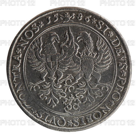 Thaler (Gulden), Pawel (publisher). Jerzy Fryderyk (Duke of Karniów; 1539–1603) — iconography: eagles, male bust in armour, rosettes. Obverse: half-figure in armour turned right, separating the double inner border and rim; sceptre in right hand, left resting on sword hilt. Rim inscription: GEORG, DDG MARCH BRAND DVX PRVSSIAE &C (crosses between words; ligature AE in PRVSSIAE). Reverse: in the field, left the Brandenburg eagle with Hohenzollern coat of arms on its breast, right the Prussian eagle with crowned letter S on its breast. Below, in a shield topped with a lily, value numeral 60. Rim inscription: SI DEVS PRO NOBIS QVIS NTRA NOS I5 86 (rosette between words; mint mark between date numerals). 1586. Ducal Prussia (1525–1701), Königsberg. Coin; diameter 36.9 mm; weight 24.64 g; axis 45°.