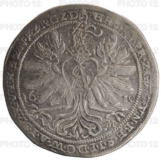 Thaler; obverse: torso facing right in a ruff and decorative armor girded with a sash, a scepter in his right hand, left hand resting on a helmet with raised visor and plume standing on a table; figure's head divides the inner border; rim between borders with inscription beginning with an orb royal GE, .WIL, LVGGMARC.Z.BRAN.DE.HEI.RO.REI.ERT.CA.VN. Reverse: Prussian eagle, on its breast within a crowned heart shield a monogram composed of the letters SA; date numerals 16 - 20 flanking the eagle; rim between borders with inscription starting with an orb, PR.ZG, C.VN.BE.SIPD:CWAISZKVIHBZNFZRGZD; under the eagle's claws, on both sides L - M, 1620. Portrait/subject: George William of Hohenzollern (Elector of Brandenburg; Prince of Prussia; 1620–1640) — Ducal Prussia (1525–1701). Coin: diameter 44.2 mm, weight 28.07 g, axis 225°.
