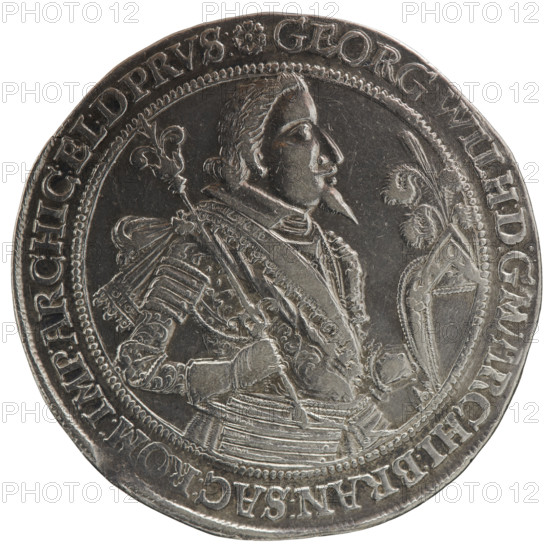 Thaler. Obverse: torso facing right in collar and decorative armour girded with a sash, sceptre in right hand, helmet with raised visor and plume in left hand; rim inscription beginning with a rosette: GEORG:WILH:D:G:M,RCHI:BRAN:SAC:ROM:IMP:ARCHIC:EL:D.PRVS:. Reverse: twenty-four-field coat of arms with ornaments, topped with seven jewels; date numerals 16·28 separated by jewels; half-rim between the rims with inscription beginning with a rosette and ending with a heart: ANCK.BEDENCK.DAS.ENDE. Portrait identifies George William Hohenzollern (Elector of Brandenburg; Duke of Prussia; 1620–1640). 1628; Ducal Prussia (1525–1701), Königsberg. Coin; diameter 43.1 mm; weight 29.04 g; axis 45°.