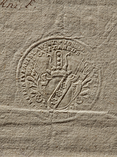 Seal of Józef Ignacy Brzezinski, Starost of Inowroclaw. Round impression of the seal. Oval cartouche under a crown, with a jewel and panoplies bearing the Doliwa coat of arms. In the double rim the inscription: IOSE. IGNATUS BRZEZINSKI INNIVLADISLAW // CAPITANEUS, 1772, Poland. Maker: Zurakowski, Witold (?-1927)., The image shows an embossed circular seal pressed into textured paper, with a central shield bearing a diagonal band decorated with small rounded shapes and flanked by ornamental flourishes and a crown-like element above; the paper surface is fibrous and rough with visible creases and a few small darker flecks, and the overall colors are various shades of beige and light brown.