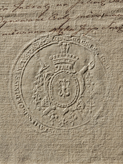 Seal of the Starost of Krasnostaw, Starost of Krasnostaw (ca. 1789), Zurakowski, Witold (?-1927), coat of arms seals, document seals, private seals, seals of starosts, Gozdawa (coat of arms). Round impression of the seal of the Starost of Krasnostaw. In an oval cartouche, on a red background, the Gozdawa coat of arms with a jewel above the crown. Behind the cartouche, a sword and an axe are visible; below, on a ribbon, an order. Illegible inscription on the rim, 1789, Poland, seal., A close-up of textured beige paper showing an embossed circular seal with ornate heraldic motifs including a crowned oval cartouche, decorative leaves or floral elements, and ribbon-like ornaments, and the upper area of the paper contains dark brown cursive handwriting; the visible colors are beige and dark brown.