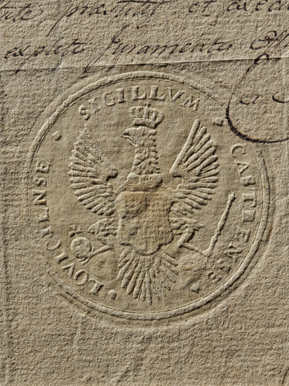 Seal of the starost of the town of Lowicz (ca. 1789), Zurakowski, Witold (?-1927). Round imprint of the seal of the Lowicz stronghold. In the field of the seal, a crowned White Eagle with a scepter and an apple in its talons; on the chest, a shield probably bearing the coat of arms of Lowicz. In the rim, an inscription: SIGILLVM CASTRENSE LOVICIENSE, 1789. Poland., A textured beige paper surface with an embossed circular seal showing a heraldic eagle with outstretched wings and a crown above its head; the seal has a raised border and decorative elements around the eagle, and there is a curved dark ink mark near the top right along with a few strokes of dark handwriting visible near the top edge; colors visible include shades of beige, tan, brown, and dark brown.