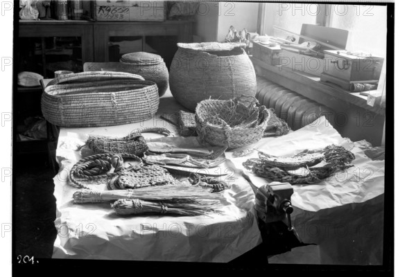 Józef Grein's Conservation Studio interior showing objects from the excavations in Edfu obtained during the Polish-French archaeological campaign in 1937, conducted by Prof. Kazimierz Michalowski and Prof. Jerzy Manteuffel; photographer Zofia Kruze-Tomaszewska (1909–2003), glass negative; subjects: Ancient Egypt, excavation objects, baskets, ancient ceramics; conservation of monuments; war losses; archaeology; date 07–09.1937; photography from life; negative; image size 13 × 18 cm.