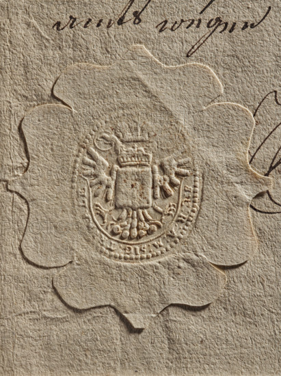 official seal; documents; Zurakowski, Witold (?-1927); official seals; seals attached to documents; coat of arms with wings, claws and a crown; 1777; Poland; Lviv; seal, A textured beige paper with a scalloped embossed seal in the center showing a raised heraldic design featuring a shield topped by a crown and flanked by stylized wings or feathers, with decorative floral-like elements below; the paper shows visible fibers and creases, and there are dark brown ink pen strokes partly visible near the top and right edges.
